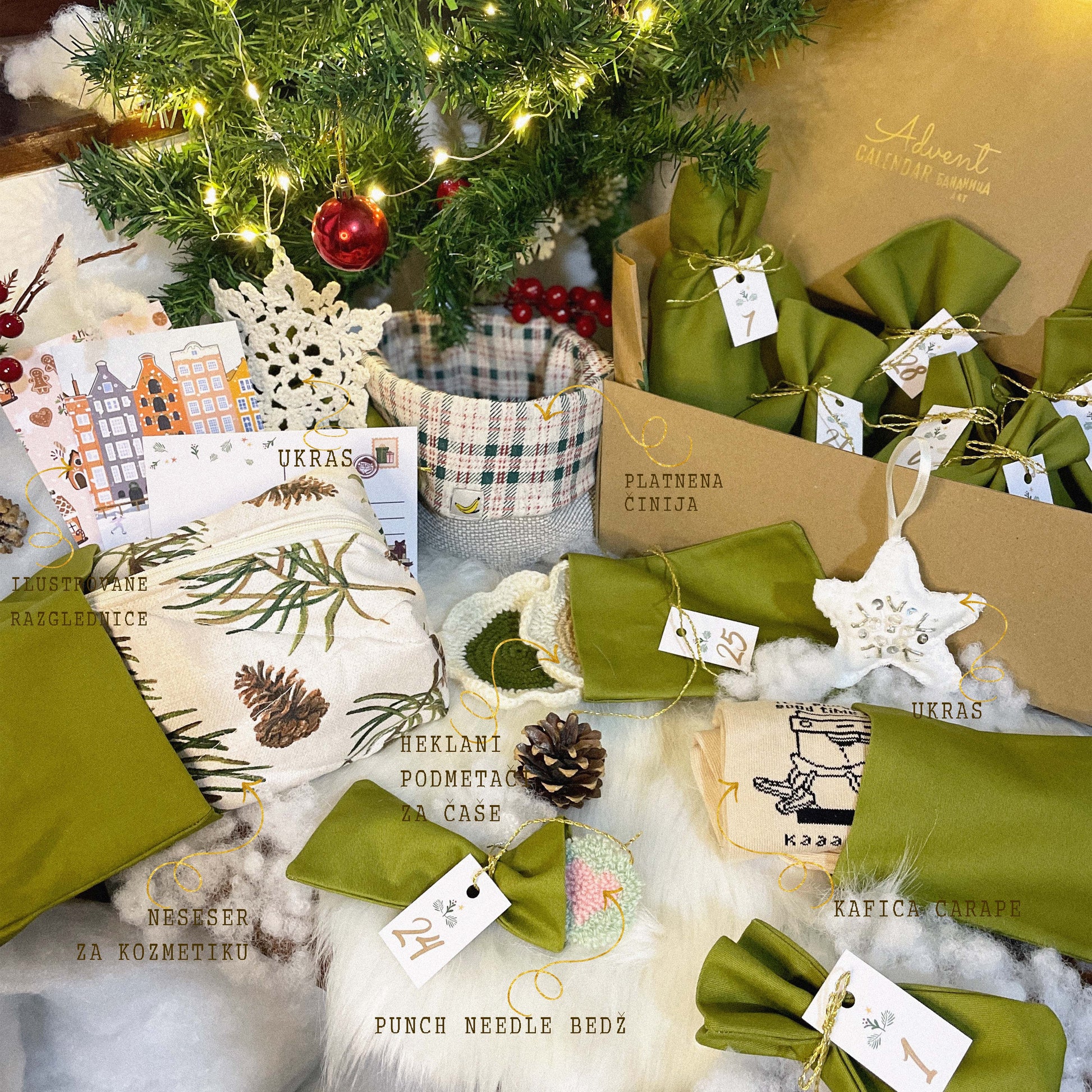 Green decorative items with tags on a textured surface near a Christmas tree.